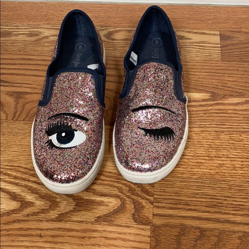 Pink sparkle slip on shoes with winking eye